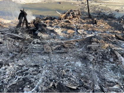 Photograph 1 – View of the accident site looking down the hill towards the river., from the NTSB investigation of Douglas C54D accident near Fairbanks, Alaska, April 23, 2024