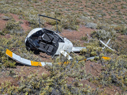 Photograph 1 – View of top of accident helicopter and rotors, from the NTSB investigation of Robinson Helicopter R22 BETA accident near Kailua-Kona, Hawaii, May 30, 2024