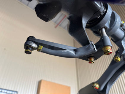 Photograph 1 – Push pull tube fractured at bell crank, from the NTSB investigation of Robinson R44 accident near Honolulu, Hawaii, August 19, 2024