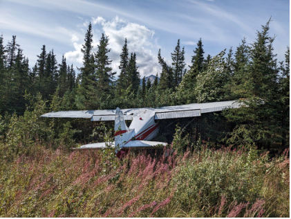 Photograph 1 – View of the airplane where it came to rest., from the NTSB investigation of Cessna 170B accident near Healy, Alaska, August 15, 2024