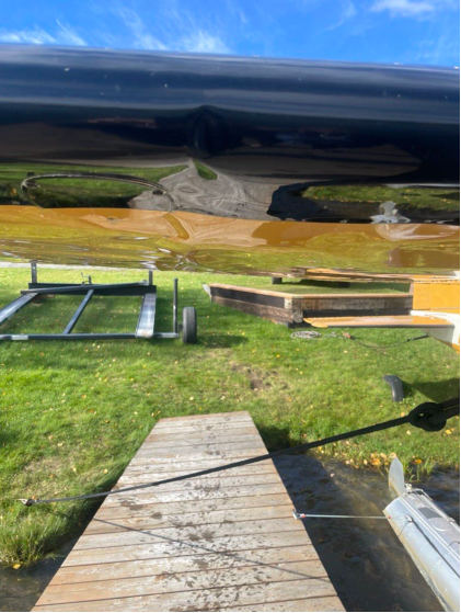Photograph 1 – View of damage to the bottom of right wing, from the NTSB investigation of Cessna 180B accident near Anchorage, Alaska, September 14, 2024