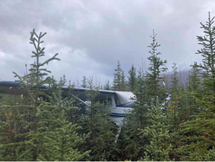 Photograph 1 – View of airplane where it came to rest, from the NTSB investigation of Cessna 170 accident near Mckinley Village, Alaska, September 17, 2024