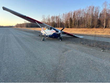 Photograph 1 – View of airplane where it came to rest, from the NTSB investigation of Cessna A185F accident near Wasilla, Alaska, October 20, 2024