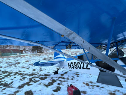 Photograph 2 – Damage to the right wing lift strut, from the NTSB investigation of Piper PA-18-150 accident near Palmer, Alaska, December 25, 2024