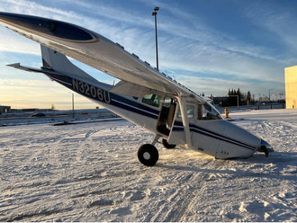 Photograph 1 – View of accident airplane on its nose, from the NTSB investigation of Cessna 182F accident near Anchorage, Alaska, February 2, 2025