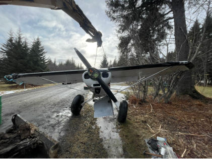 Photograph 1 – Front view of accident airplane during recovery, from the NTSB investigation of Piper PA-18-150 accident near Anchor Point, Alaska, February 28, 2025