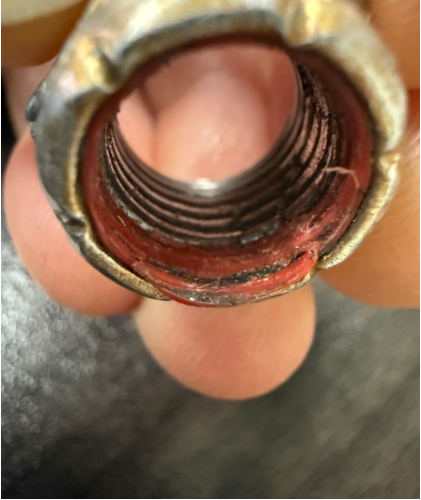 Photograph 4 – Fiber locking nut from landing gear assembly, from the NTSB investigation of Cessna A185F accident near Skwentna, Alaska, March 7, 2025
