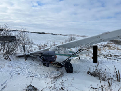 Photograph 1 – Accident airplane at accident site, from the NTSB investigation of Piper PA-18-150 accident near Bethel, Alaska, April 9, 2025