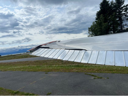Photograph 1 – Image of damage to left wing, from the NTSB investigation of Cessna 170B accident near Homer, Alaska, July 9, 2025