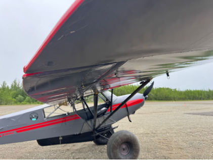Photograph 1 – View of bottom of right wing and right side of fuselage, from the NTSB investigation of Piper PA-18-150 accident near Willow, Alaska, June 3, 2025