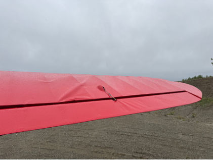 Photograph 2 – View of damage to the top of the right wing., from the NTSB investigation of Piper PA-18-150 accident near Willow, Alaska, June 3, 2025