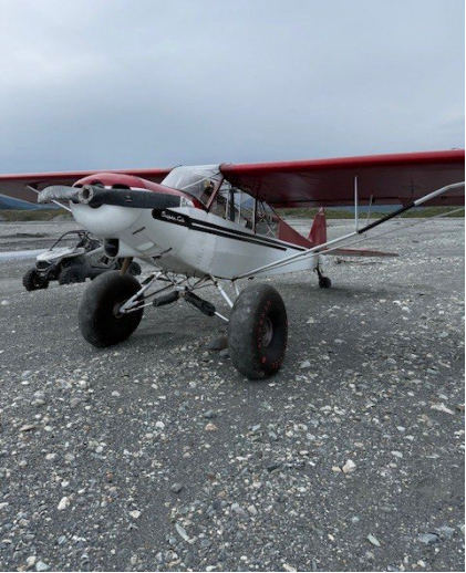 Photograph 1 – Image of fuselage, left wing, and lift strut, from the NTSB investigation of Piper PA-18-135 accident near Palmer, Alaska, July 11, 2025