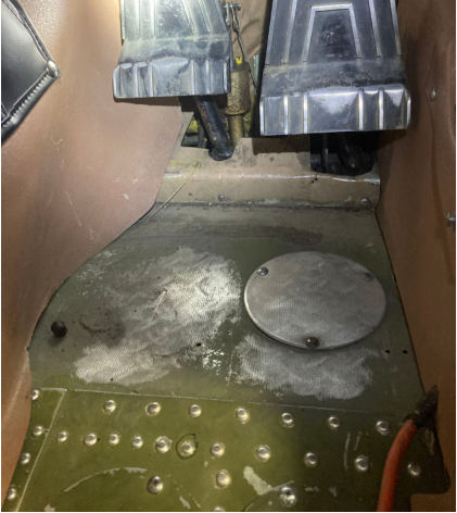Photograph 2 – View of left and right rudder pedals., from the NTSB investigation of Cessna 180H accident near Gulkana, Alaska, July 17, 2025