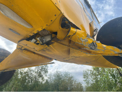 Photograph 2 – View of landing gear. Bungees still attached, fractures from overload from hard landing., from the NTSB investigation of Aviat Aircraft INC A-1B accident near Chisana, Alaska, August 2, 2025