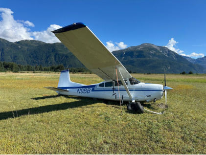 Photograph 1 – View of right side of airplane where it came to rest., from the NTSB investigation of Cessna A185F accident near Haines, Alaska, August 18, 2025