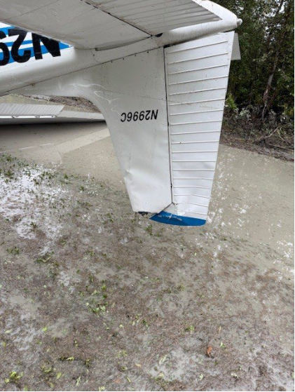 Photograph 4 – Damage to the vertical stabilizer and rudder, from the NTSB investigation of Cessna 180 accident near Willow, Alaska, September 1, 2025