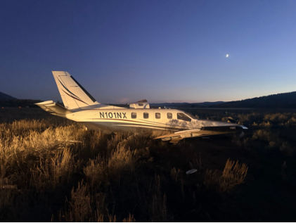 Photograph 1 – Right side of accident airplane at accident site., from the NTSB investigation of Socata TBM 700 accident near Alpine, Wyoming, September 28, 2025