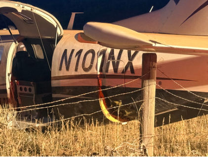Photograph 2 – Left rear of accident airplane at accident site., from the NTSB investigation of Socata TBM 700 accident near Alpine, Wyoming, September 28, 2025