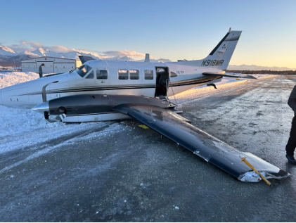 Photograph 1 – Image of left side of accident airplane, from the NTSB investigation of Beech 65-A90-1 accident near Anchorage, Alaska, January 16, 2026