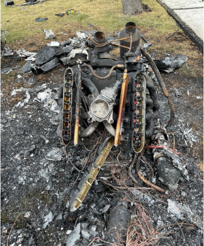 Photograph 10 – View of the engine during the engine examination at the accident site, from the NTSB investigation of Vertical Aviation Technologies Hummingbird accident near Spring Branch, Texas, April 29, 2024