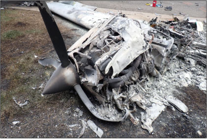 Photograph 3 – Engine and propeller, from the NTSB investigation of Beech V35A accident near Arvada, Colorado, June 7, 2024