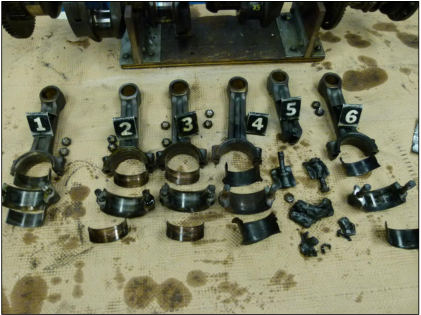 Photograph 6 – Engine examination – connecting rods and bearings, from the NTSB investigation of Beech V35A accident near Arvada, Colorado, June 7, 2024
