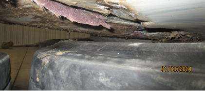Photograph 2 – Damage to wing, from the NTSB investigation of Cirrus Design CORP SR22T accident near Davenport, Iowa, December 31, 2023