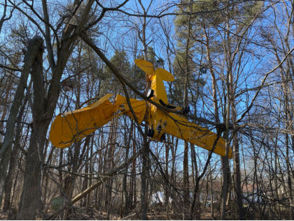 Photograph 3 – Damaged left wing and wing struts, from the NTSB investigation of Piper J3C-65 accident near South Lyon, Michigan, February 12, 2024