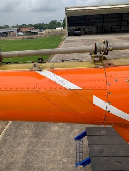 Photograph 3 – Closeup of Substantial Damage to the Tailboom, from the NTSB investigation of Bell 206B accident near Baton Rouge, Louisiana, March 26, 2024
