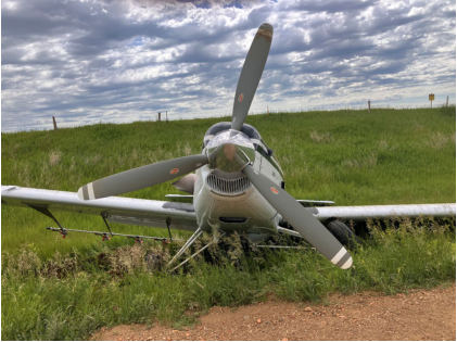 Photograph 2 – View of the front of the airplane at the accident site, from the NTSB investigation of Thrush Aircraft INC S2R accident near Hebron, North Dakota, June 17, 2024