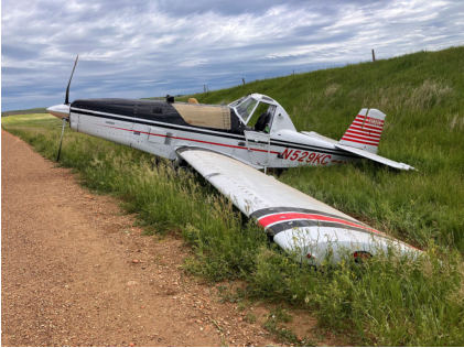 Photograph 4 – View of the left side of the airplane at the accident site, from the NTSB investigation of Thrush Aircraft INC S2R accident near Hebron, North Dakota, June 17, 2024