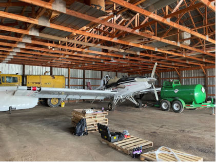 Photograph 5 – View of the airplane recovered to the operator’s hangar, from the NTSB investigation of Thrush Aircraft INC S2R accident near Hebron, North Dakota, June 17, 2024