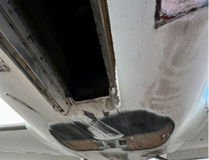 Photograph 2 – View of bottom of fuselage showing exposed core material, from the NTSB investigation of American Air Racing INC LANCAIR IVP accident near Midland, Texas, June 29, 2024