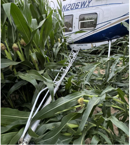 Photo 1 – Helicopter at accident site, left, from the NTSB investigation of Bell 206L-3 accident near Thorntown, Indiana, July 8, 2024