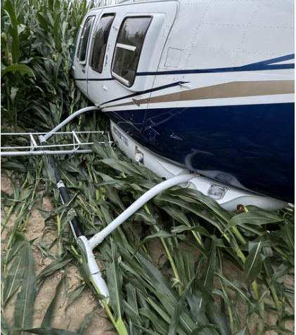 Photo 2 – Helicopter at accident site, aft left, from the NTSB investigation of Bell 206L-3 accident near Thorntown, Indiana, July 8, 2024