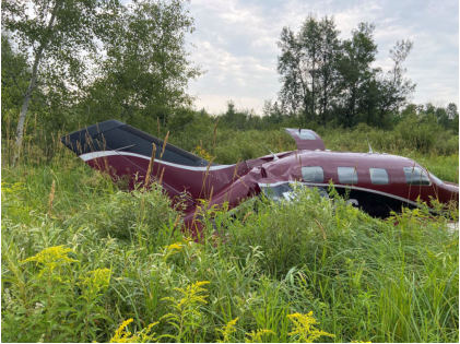 Photograph 1 – View of the right side of the airplane at the accident site, from the NTSB investigation of Piper PA46 accident near Radisson, Wisconsin, July 28, 2024