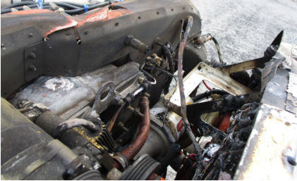 Photograph 4: Engine Compartment Thermal Damage, from the NTSB investigation of Cirrus Design CORP SR22T incident near Tulsa, Oklahoma, August 3, 2024