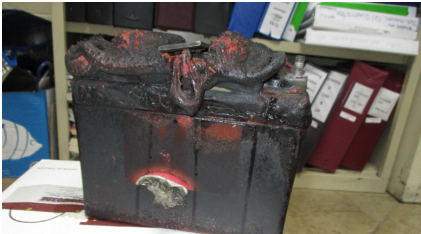 Photograph 5: Damage to Battery, from the NTSB investigation of Cirrus Design CORP SR22T incident near Tulsa, Oklahoma, August 3, 2024