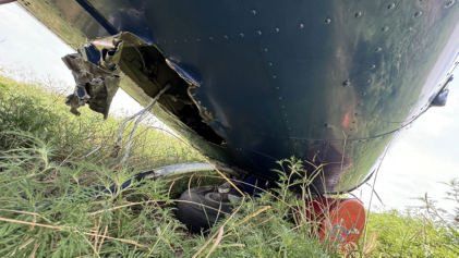 Photograph 2 – Fuselage/Belly Damage, from the NTSB investigation of Cessna 208 accident near Whitewright, Texas, August 11, 2024