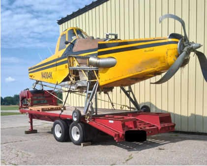 Photograph 9 – View of the fuselage with both wings, the landing gear, and the empennage removed, from the NTSB investigation of Ayres Corporation S2R accident near Stanwood, Michigan, June 20, 2024