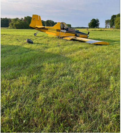 Photograph 1 – View of the right side of the airplane at the accident site, from the NTSB investigation of Ayres Corporation S2R accident near Stanwood, Michigan, June 20, 2024