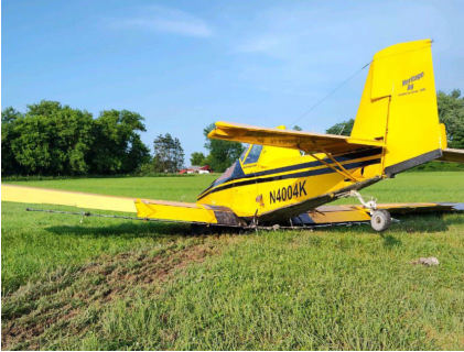 Photograph 4 – View of the rear of the airplane at the accident site, from the NTSB investigation of Ayres Corporation S2R accident near Stanwood, Michigan, June 20, 2024