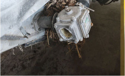 Photograph 6 – View of the substantial damage sustained to the left side of the lower fuselage, from the NTSB investigation of Ayres Corporation S2R accident near Stanwood, Michigan, June 20, 2024