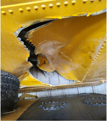 Photograph 7 – View of the substantial damage sustained to the underside of the right wing, from the NTSB investigation of Ayres Corporation S2R accident near Stanwood, Michigan, June 20, 2024