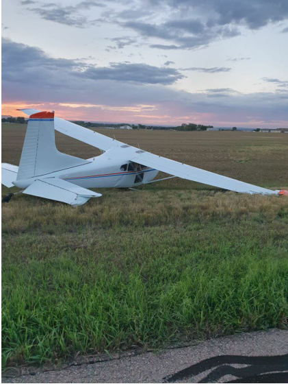 Photograph 4 – View of the right side of the airplane at the accident site, from the NTSB investigation of Cessna A185 accident near Loveland, Colorado, August 20, 2024