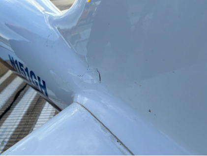 Photograph 2 – Substantial Damage on Fuselage Adjacent to Left Horizontal Stabilizer, from the NTSB investigation of Amateur-built VM1 accident near Oshkosh, Wisconsin, August 27, 2024