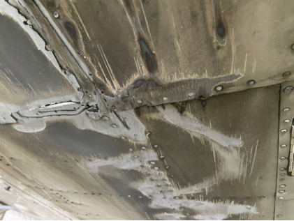 Photograph 2 – Abrasion damage to the lower fuselage, from the NTSB investigation of Beech A36 accident near Amarillo, Texas, September 10, 2024