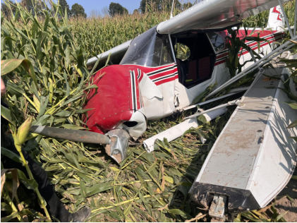 Photograph 1 – Airplane at Accident Site, Overview, from the NTSB investigation of Piper PA-12 accident near Cumberland, Wisconsin, September 12, 2024