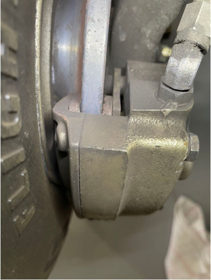 Photograph 4 – Left Brake Assembly, from the NTSB investigation of Diamond DA42 accident near Mandan, North Dakota, September 1, 2024