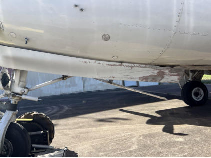 Photograph 4 – Nose Landing Gear Doors (Airport Manager Photo), from the NTSB investigation of Beech 58 accident near Shreveport, Louisiana, October 16, 2024